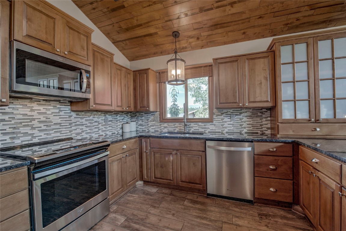 74 Big Elk Road Dillon, CO 80435 - Photo 5 of 37 a kitchen with granite countertop cabinets stainless steel appliances and a window