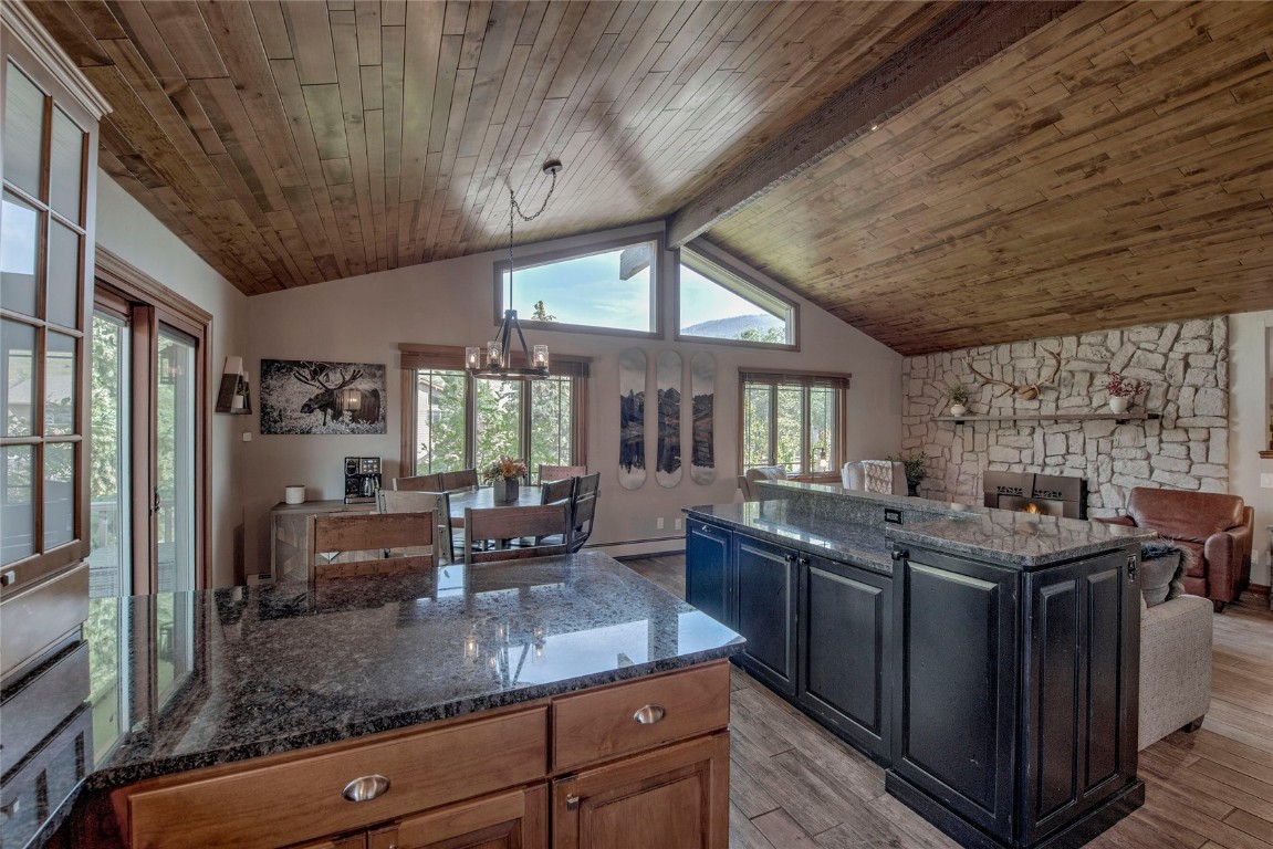 74 Big Elk Road Dillon, CO 80435 - Photo 6 of 37 a kitchen with stainless steel appliances granite countertop a sink a stove and a wooden cabinets