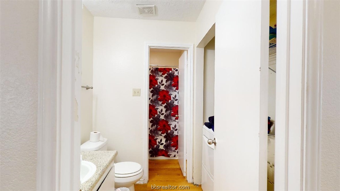1005 Spring Loop, Unit C College Station, TX 77840 - Photo 19 of 25 a bathroom with a sink toilet and shower