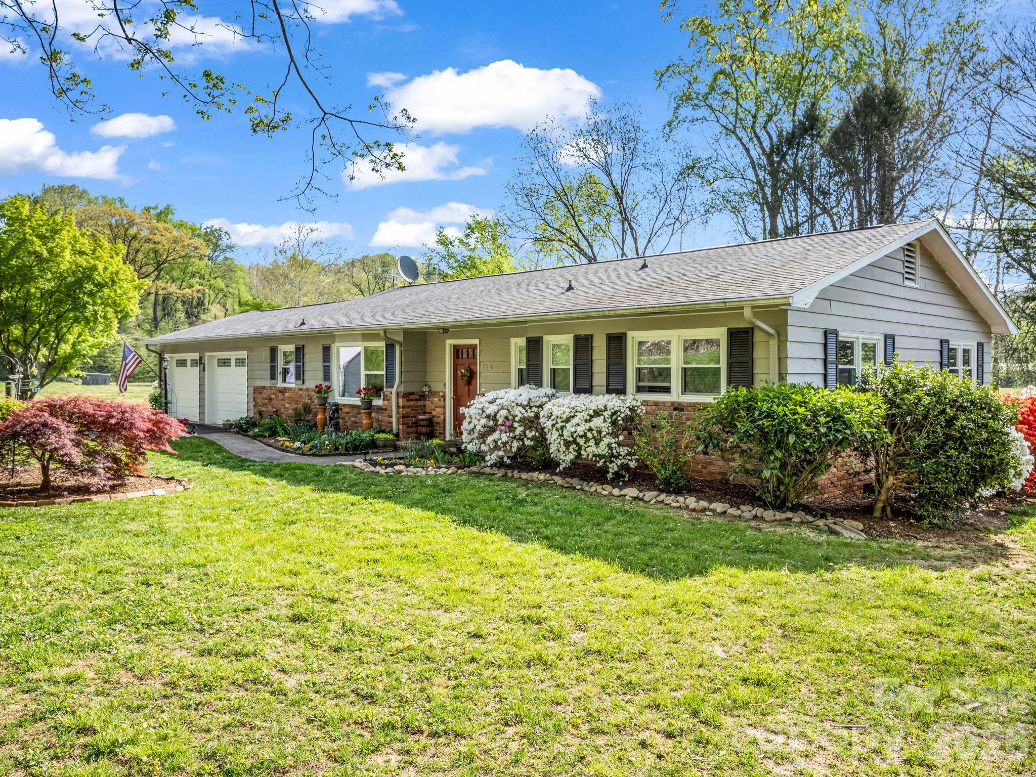 120 Warrior Drive Tryon, NC 28782 - Photo 1 of 44 a view of a house with a yard