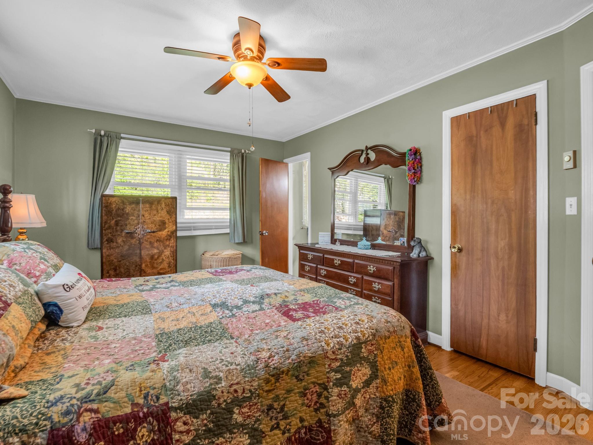 120 Warrior Drive Tryon, NC 28782 - Photo 15 of 44 a bedroom with a bed and a dresser next to a window