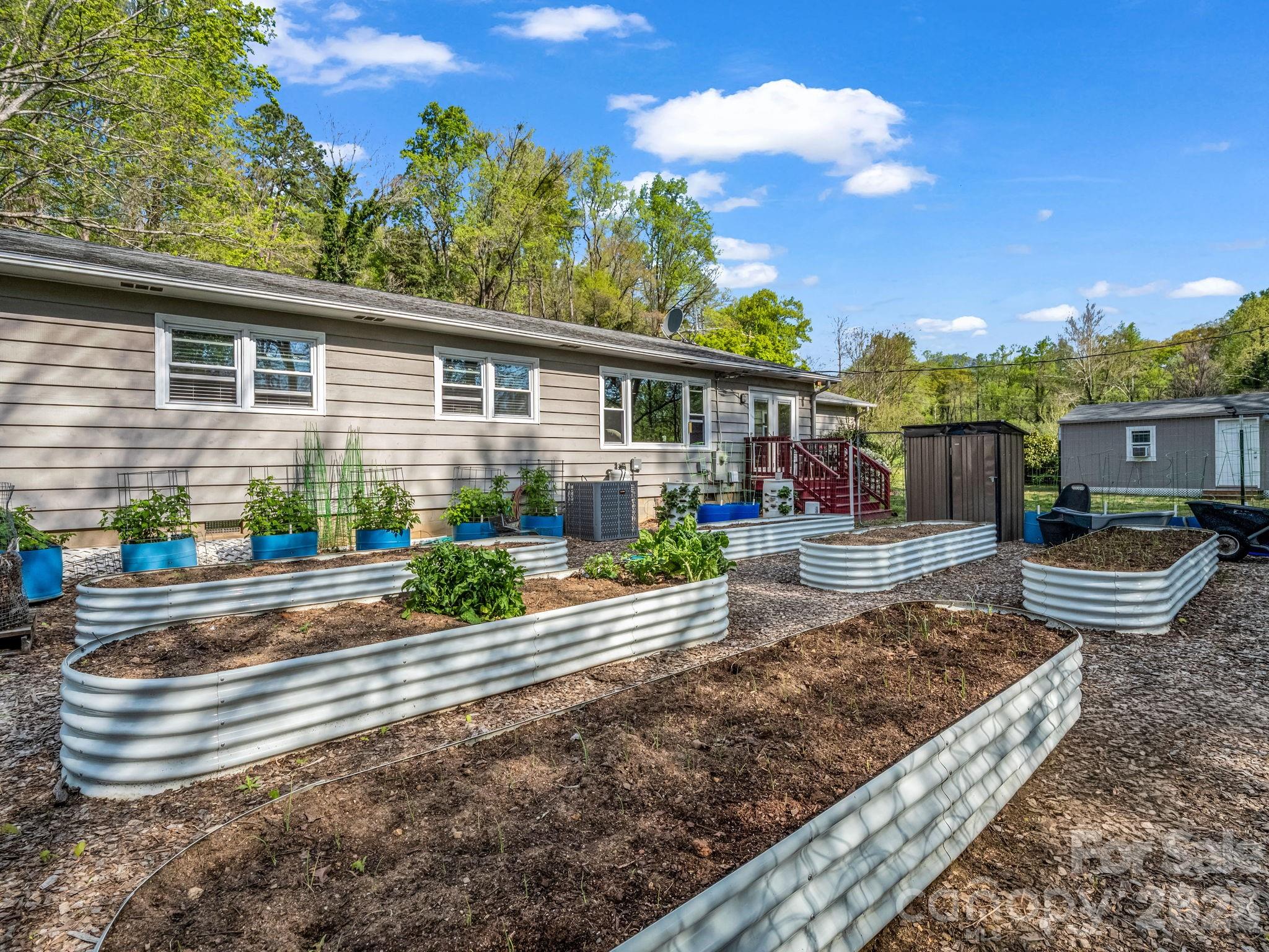 120 Warrior Drive Tryon, NC 28782 - Photo 27 of 44 a front view of a house with garden