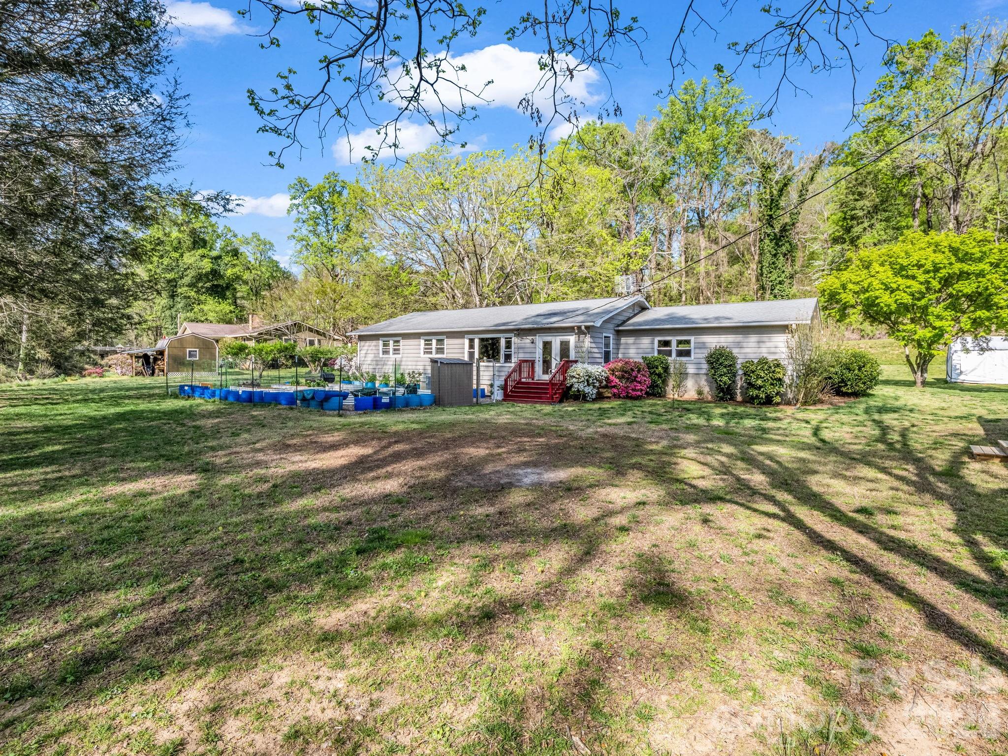 120 Warrior Drive Tryon, NC 28782 - Photo 29 of 44 a view of house with yard and swimming pool