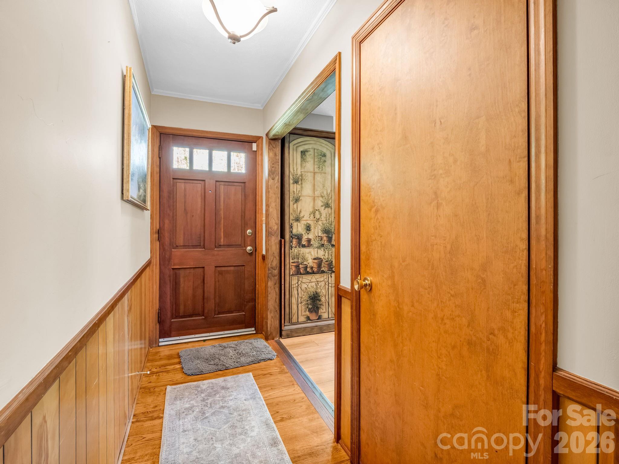 120 Warrior Drive Tryon, NC 28782 - Photo 3 of 44 a view of a hallway with wooden floor and entryway
