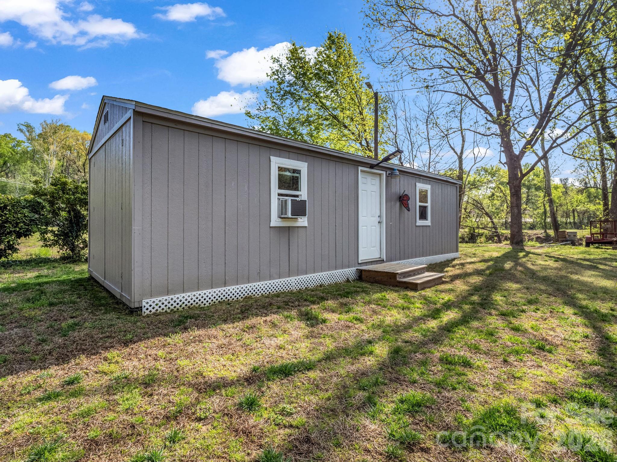120 Warrior Drive Tryon, NC 28782 - Photo 32 of 44 a backyard of a house with lots of green space