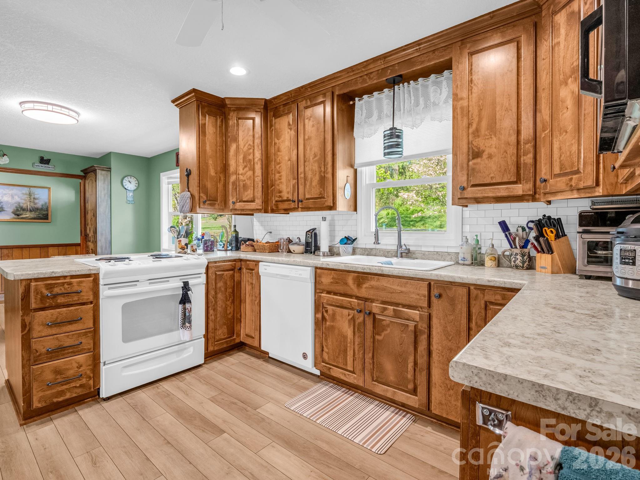 120 Warrior Drive Tryon, NC 28782 - Photo 7 of 44 a kitchen with a stove a sink and a microwave