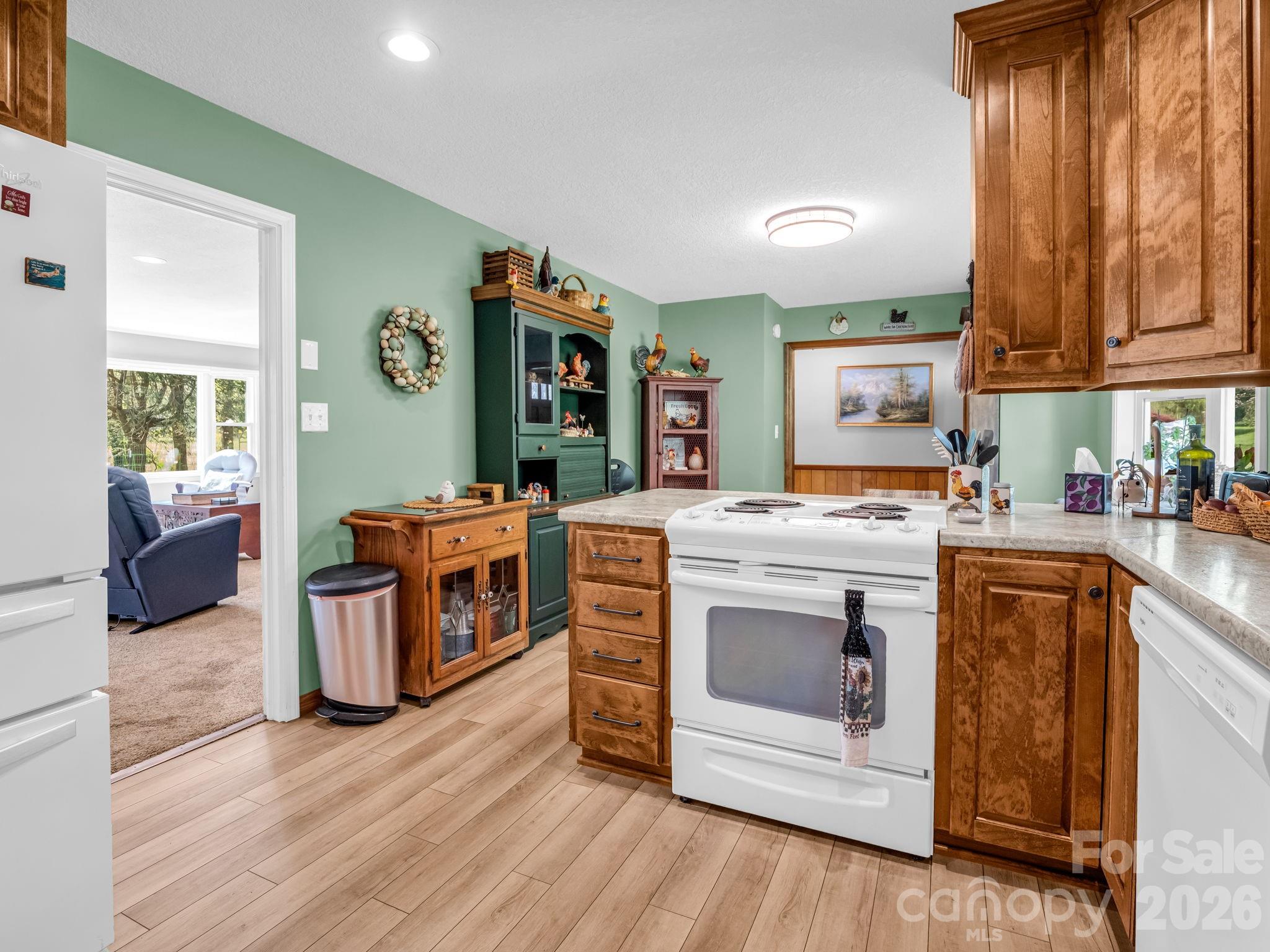 120 Warrior Drive Tryon, NC 28782 - Photo 8 of 44 a kitchen with stainless steel appliances granite countertop a stove a sink and a microwave