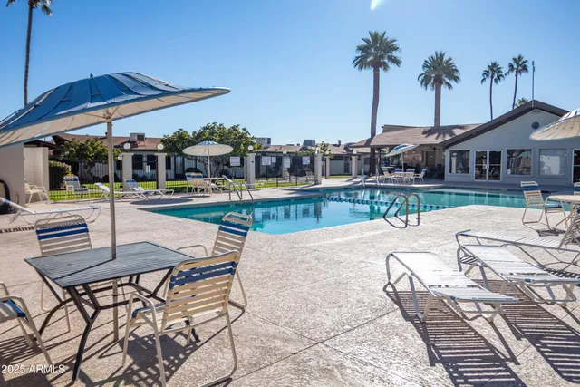 a view of a swimming pool with a deck