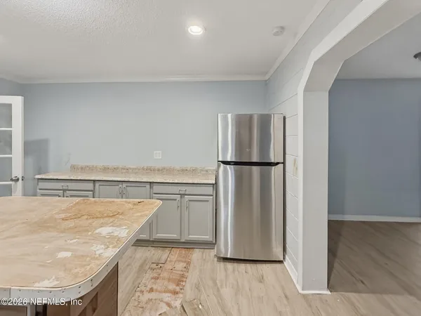 a view of kitchen and wooden floor