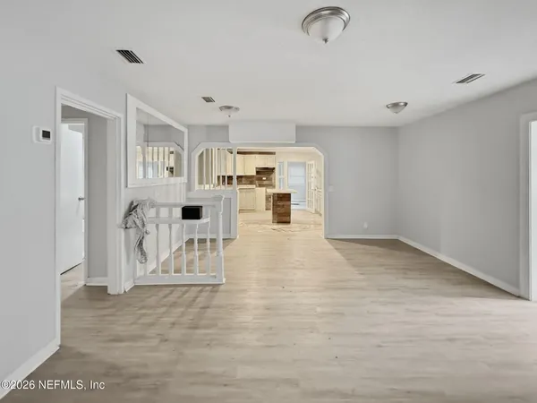 a view of a livingroom with wooden floor