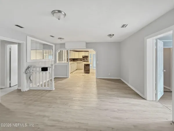 a view of kitchen with furniture and wooden floor