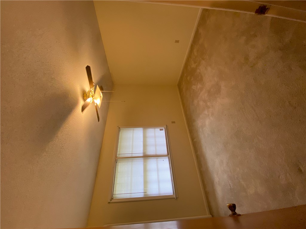 1424 East Calhoun Street Anderson, SC 29621 - Photo 8 of 10 A window offers a glimpse of the outdoors, while a ceiling fan provides air circulation.