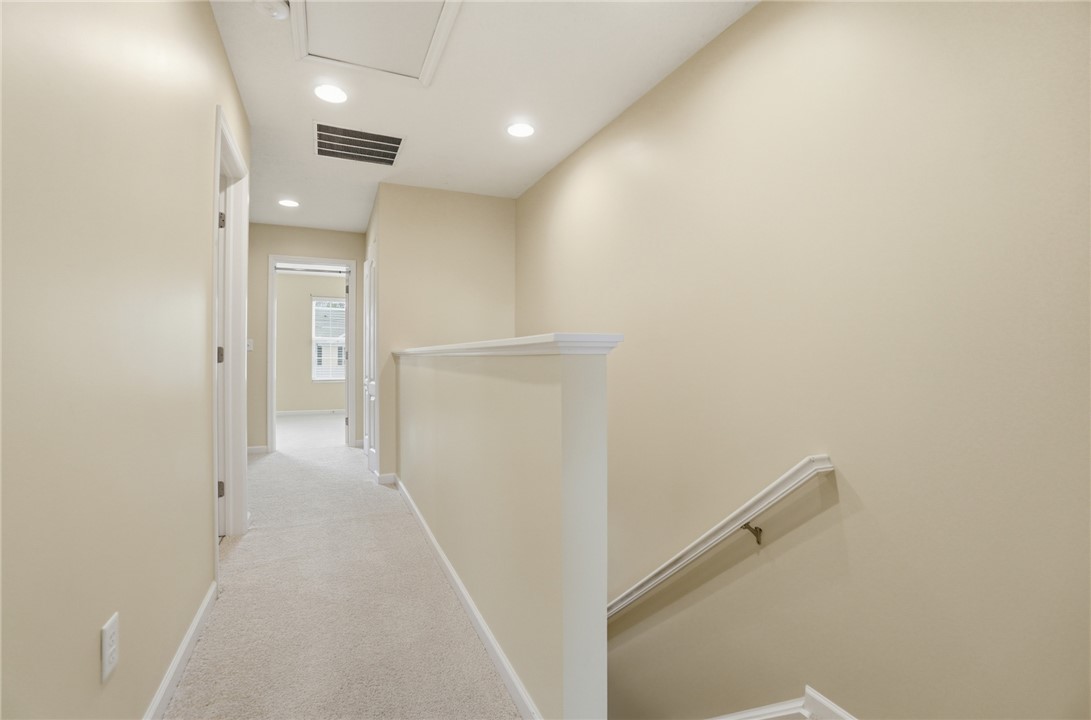 4324 Straight Arrow Road Dayton, OH 45430 - Photo 20 of 40 Bright hallway with carpeted flooring and recessed lighting offers a clean and welcoming pathway.