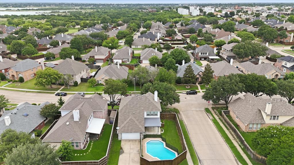 4545 Ridgepointe Drive The Colony, TX 75056 - Photo 37 of 37 Aerial perspective of a residential street with an in-ground swimming pool