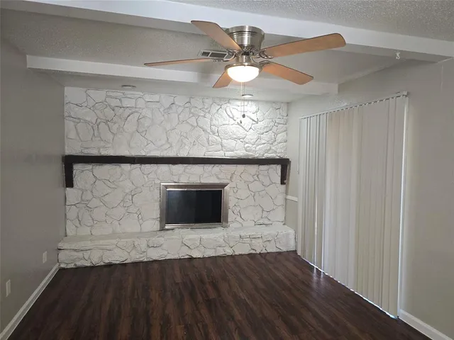 a view of fireplace and wooden floor