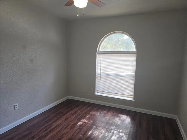 a bathroom with a toilet sink and shower