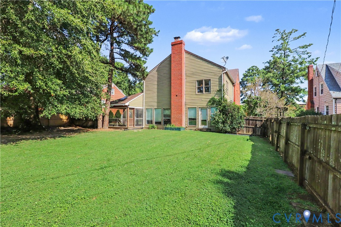 4803 Coleman Road Richmond, VA 23230 - Photo 42 of 54 Expansive backyard featuring a lush lawn, mature t