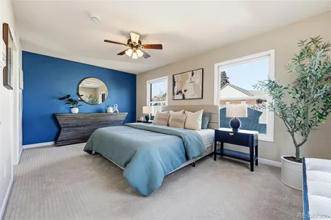 a bedroom with bed and a chandelier