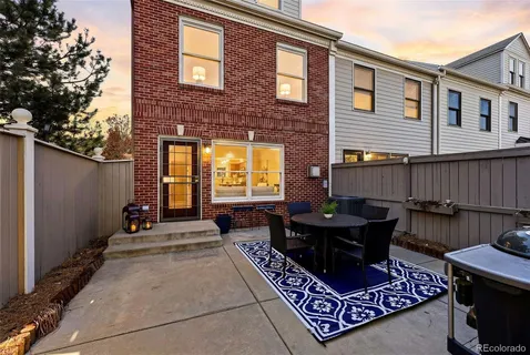 a brick building with a bench in front of it