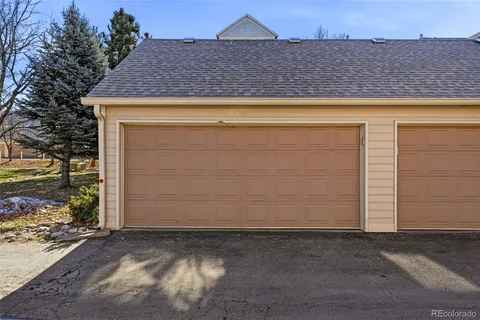 a view of backyard with garage