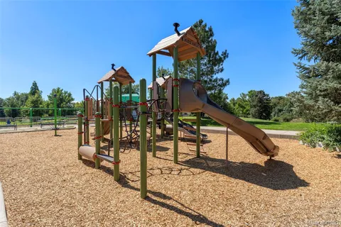 a view of a park with iron fence