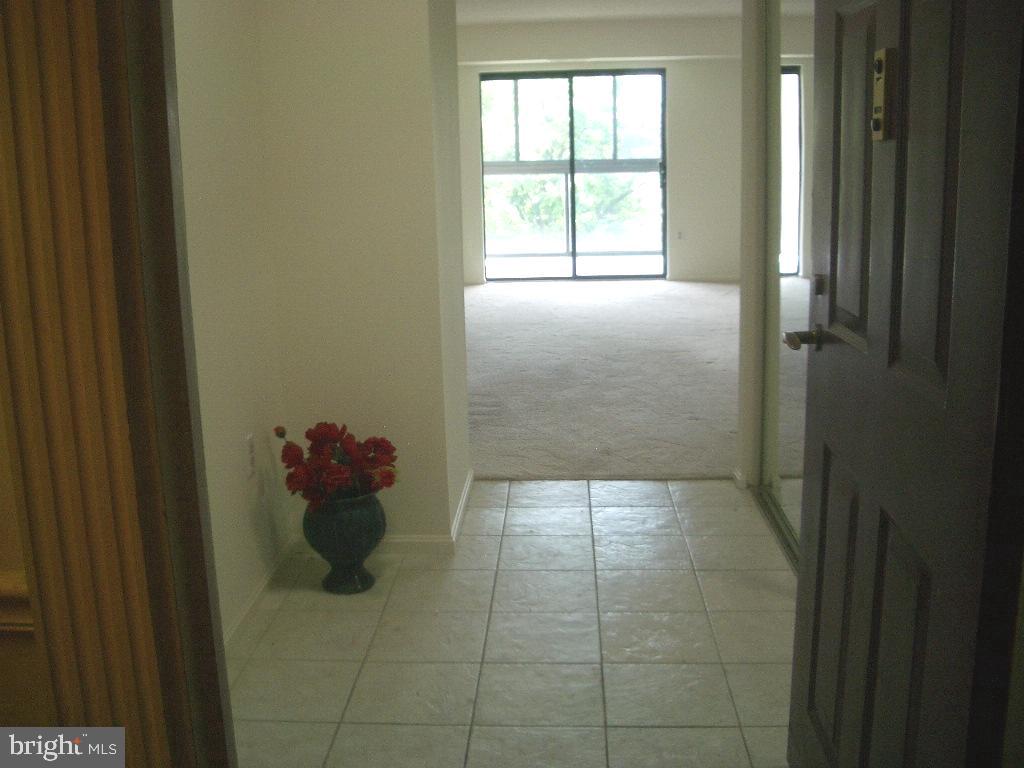 15107 Interlachen Drive, Unit 2811 Silver Spring, MD 20906 - Photo 8 of 31 Spacious Foyer with hall closet and tile floor