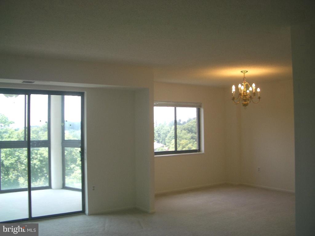 15107 Interlachen Drive, Unit 2811 Silver Spring, MD 20906 - Photo 10 of 31 Living room opens to the sunroom
