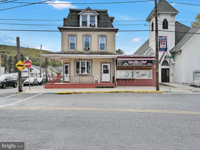 a front view of a house with a garage