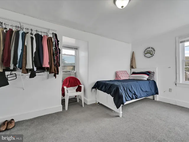 a bedroom with a bed and a closet