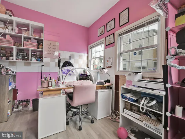 a view of a workspace with furniture and toys