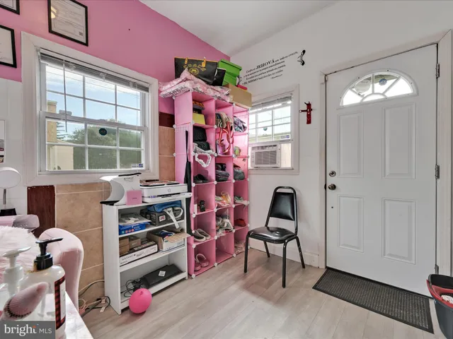 a bedroom with furniture and a window