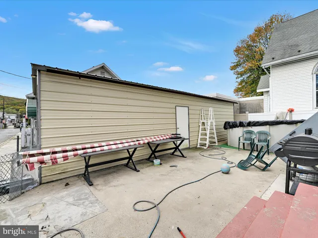 a backyard of a house with seating space