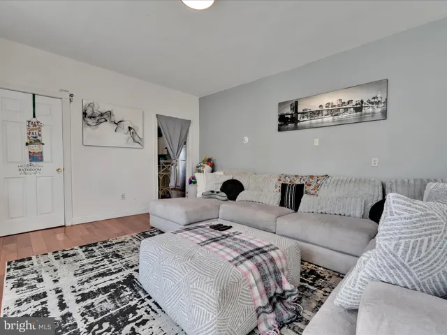 a bedroom with a large bed and a couch