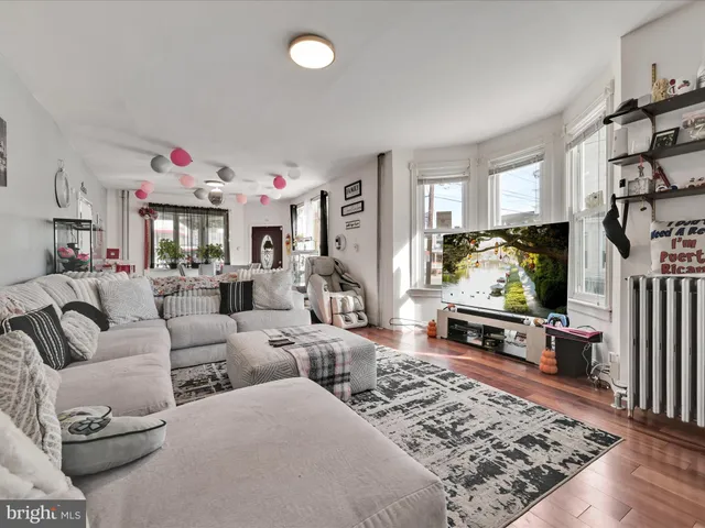 a living room with furniture and a rug