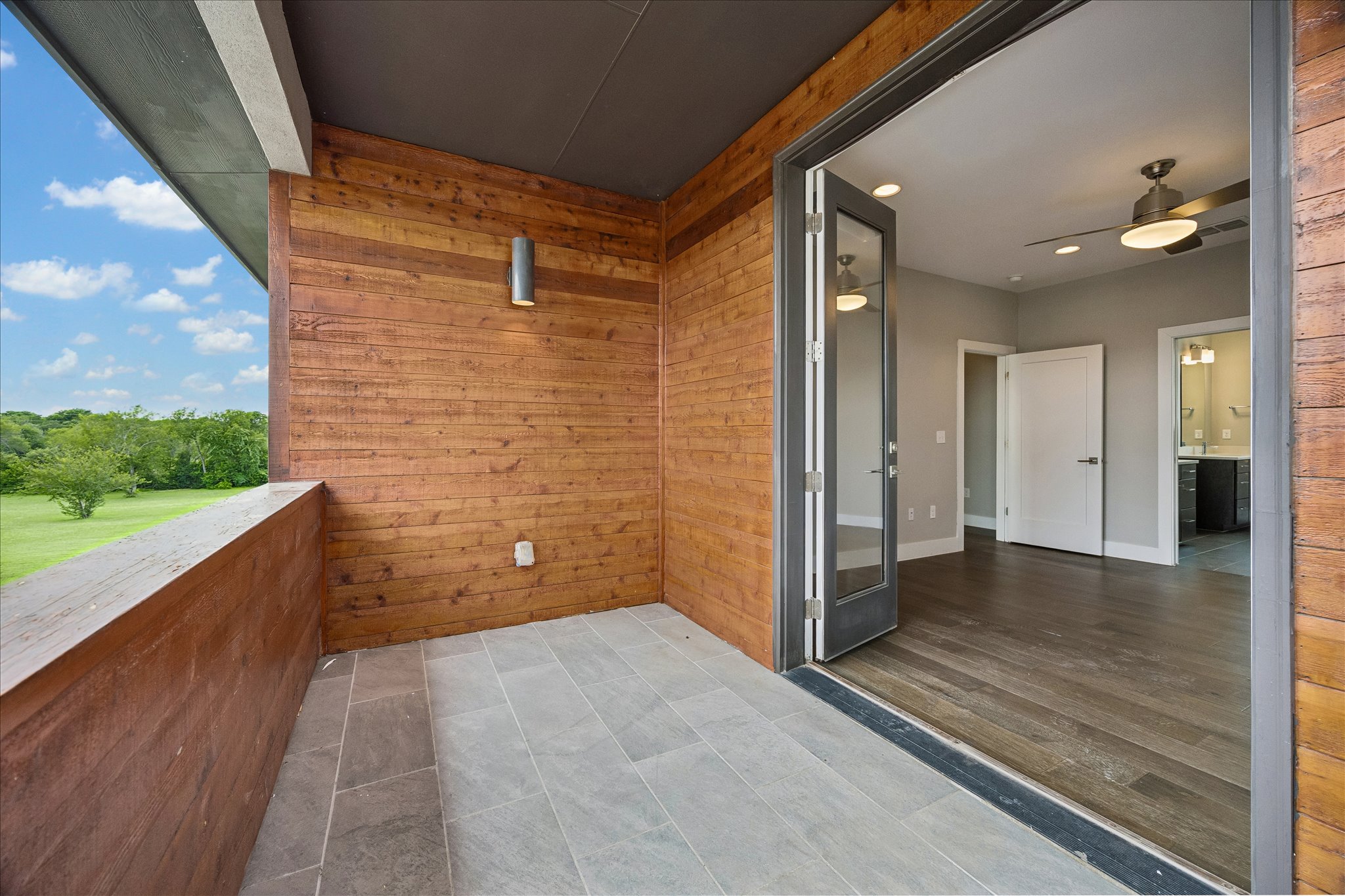 5006 Pecan Springs Road, Unit 6 Austin, TX 78723 - Photo 29 of 30 Step out onto a private outdoor patio with serene views, a perfect extension of the comfortable indoor living space.