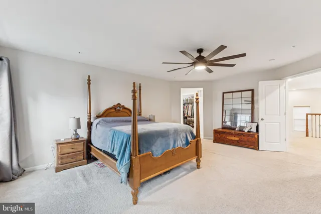 a bed room with a bed and window