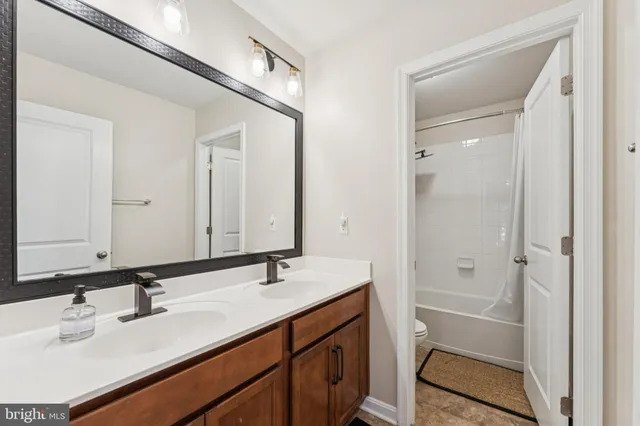 a bathroom with a sink a vanity and a mirror