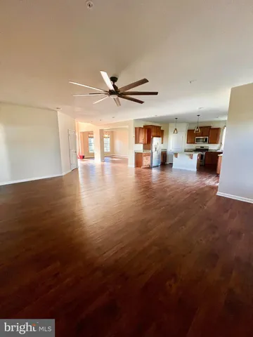 a view of a livingroom with furniture nad wooden floor