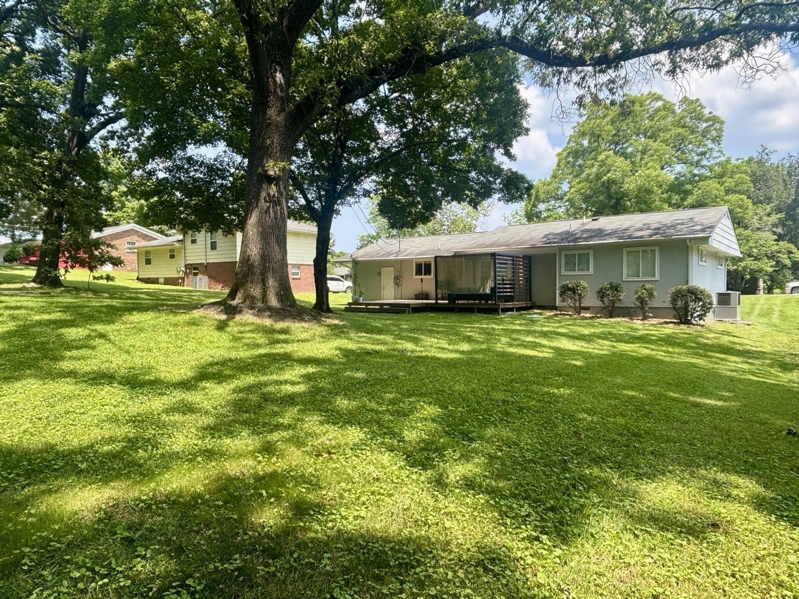 8903 Bay View Drive Chattanooga, TN 37416 - Photo 25 of 25 a view of a house with a big yard and large trees