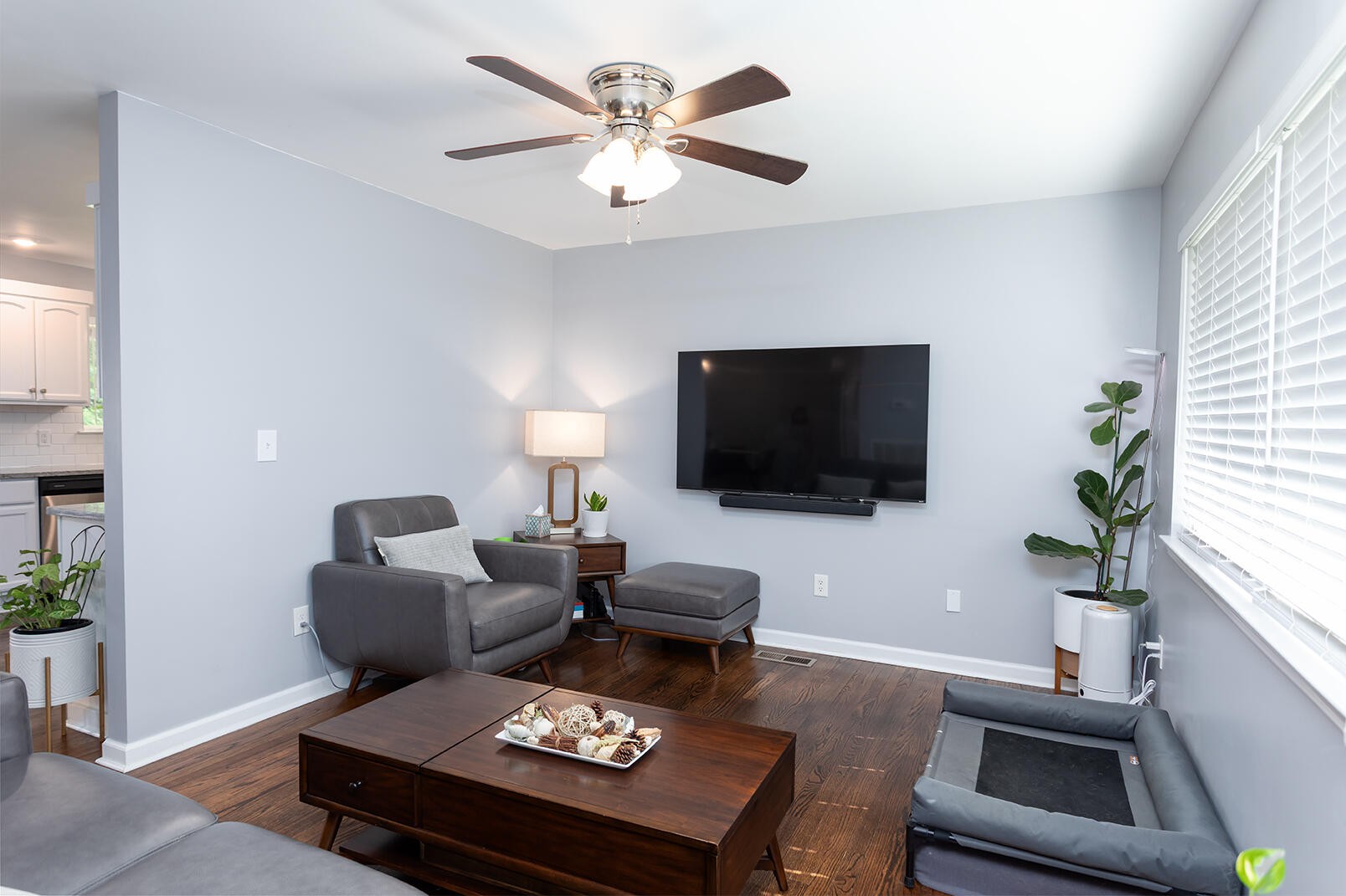 8903 Bay View Drive Chattanooga, TN 37416 - Photo 3 of 25 a living room with furniture a flat screen tv and a potted plant