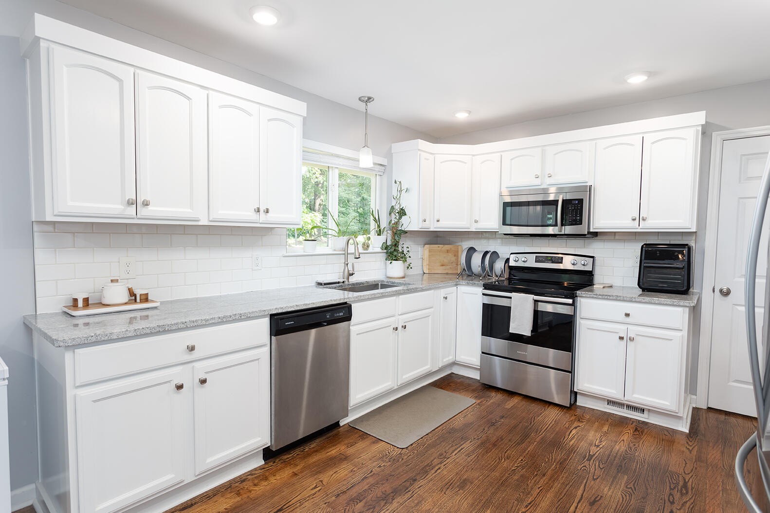 8903 Bay View Drive Chattanooga, TN 37416 - Photo 7 of 25 a kitchen with cabinets stainless steel appliances and a window