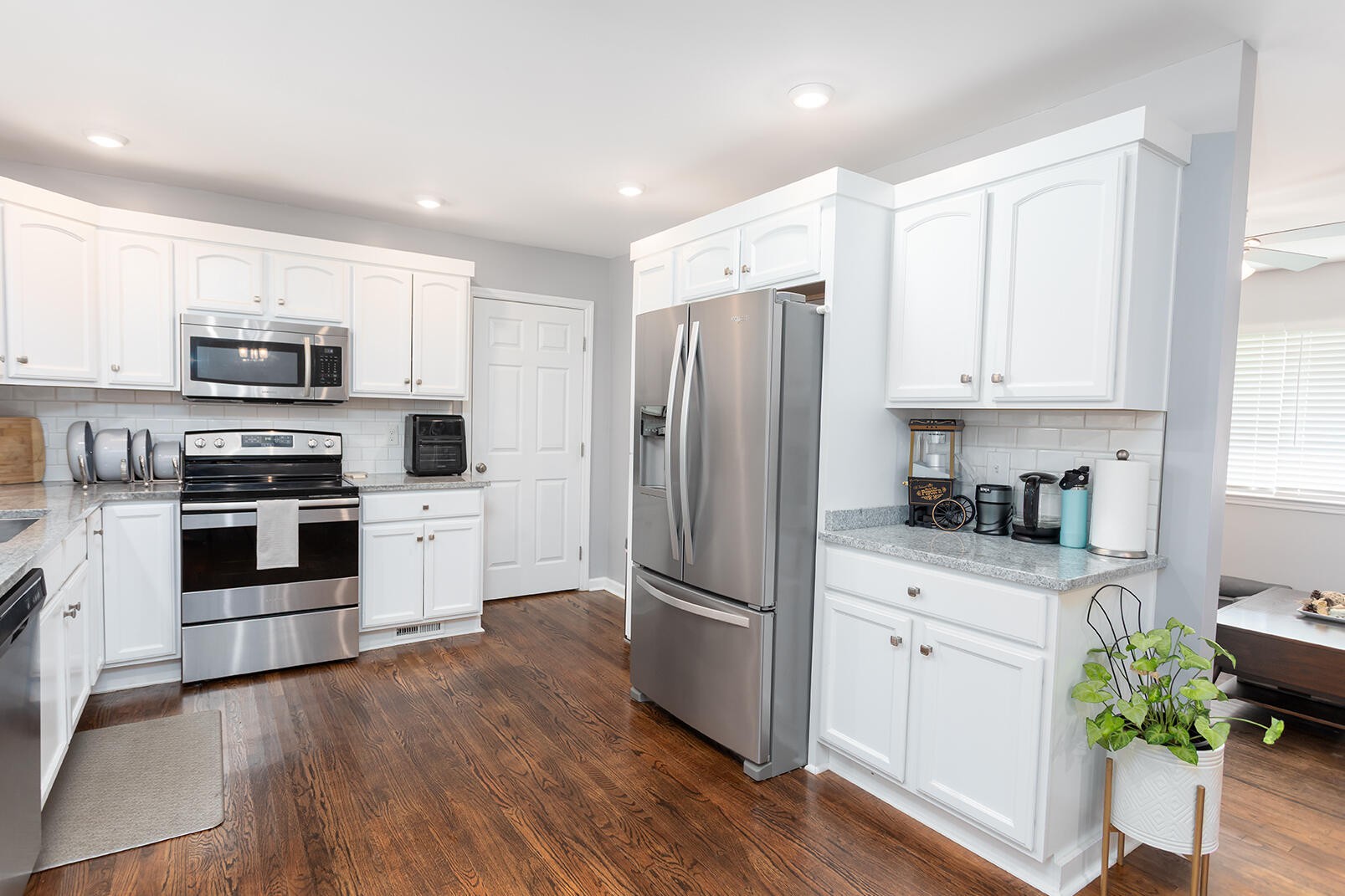 8903 Bay View Drive Chattanooga, TN 37416 - Photo 8 of 25 a kitchen with stainless steel appliances a stove a sink a refrigerator a microwave and cabinets