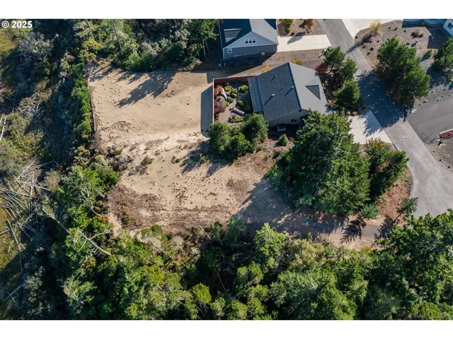 a aerial view of a house with a yard