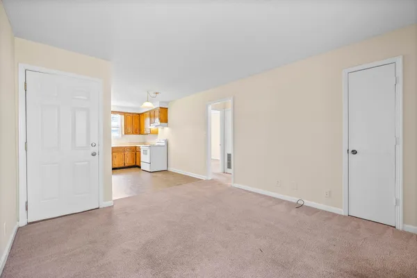 an empty room with a bathroom and a bathroom