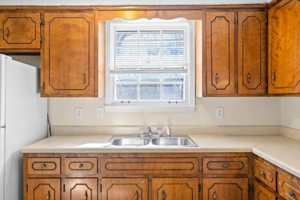 a view of a sink and a window