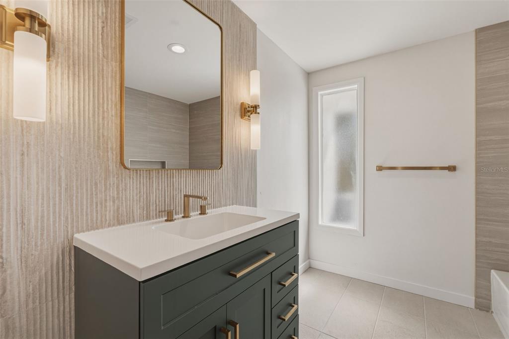 1330 Horizon Road Venice, FL 34293 - Photo 28 of 40 a bathroom with a sink and a mirror