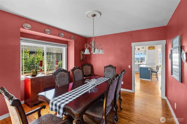 a dining room with furniture and window