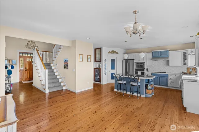 a view of a dining room with furniture and wooden floor