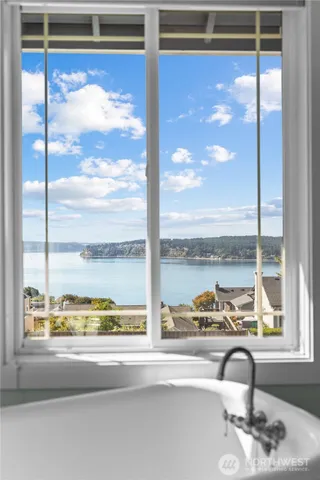 a view of a glass door with a view of the ocean