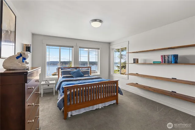 a bed room with furniture and a window